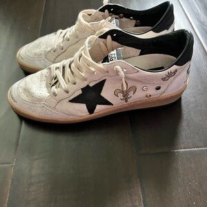 White Sneakers with Black Star and Gold Accents